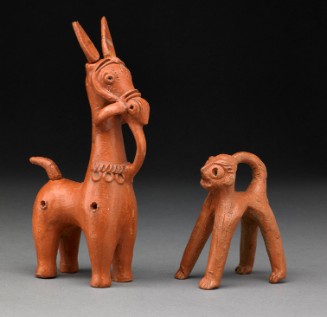 Two reddish-brown clay animal figures stand against a dark background. The taller left figure is a horse with long ears and decorative markings. The smaller right figure is a monkey with a curled tail and wide eyes.
