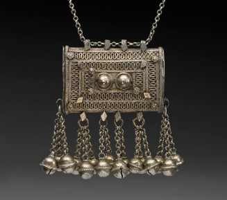 Rectangular porte Koran in silver filigree and diamond shaped applique work, with dangles/bells (shannuf) suspended on silver chain.