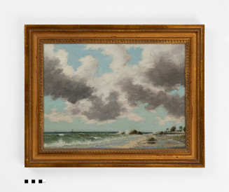 A framed painting of a seascape beneath a sky filled with heavy, dark grey clouds. Greenish waves with white crests crash onto a sandy beach, where dark rocks and distant palm trees are visible along the right shoreline.