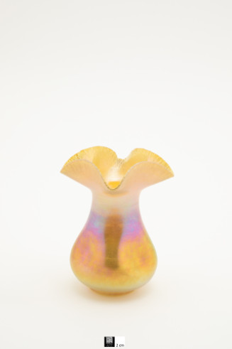 Small gold Aurene vase with indented sides and ruffled rim