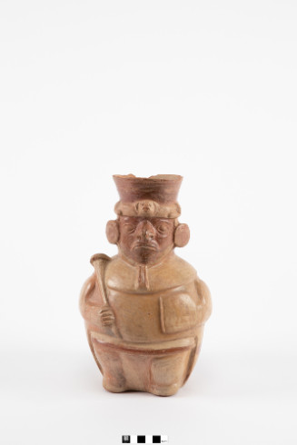 Figure of burnished mold-made ceramic with red and white paint.