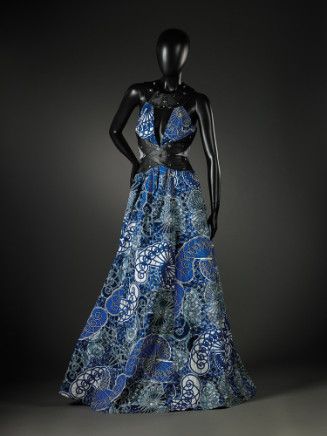 Blue halter top dress with leather and studs around the waist/stomach area, lace between the leather.