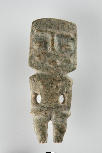 Standing female figure in the form of an axe head.  Feet form chisel end, with cut groove between, hands on abdomen, arms at side with drilled holes to separate arms from body.  Square head, nose and brow form T shape, coffee-bean eyes and mouth, cheeks and breasts are slight swells from body plane.
