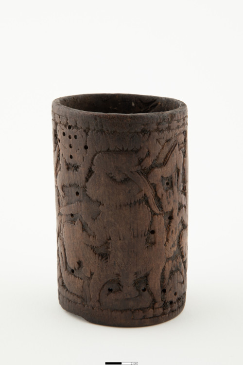 Bracelet carved with Portuguese soldiers and other devices, with surface and rich patina.