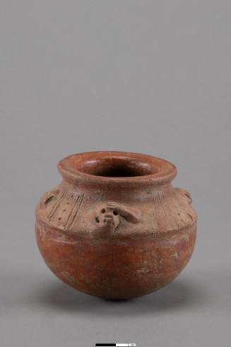 Small pot with spherical bottom, rounding into wall curving outward to two thirds height, raised ridge around wall, then sloping inward to short raised neck and outward flaring rim; brown ware with red slip, two small attached figures of monkeys, head with one arm reaching to chin, other arm reaching to forehead, on opposite sides with small nubbins in between, inscribed diagonal lines on upper wall between monkeys and nubbins.