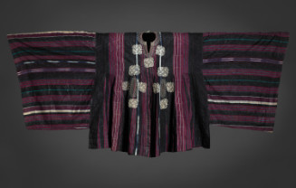 Tunic with wide sleeves constructed from narrow handwoven strips, made of hand-spun cotton; alternating alizarin, dark blue and white stripes, indigo and white ikat stripes; tan thread used for 11 embroidered "knot" motifs on center of front; also embroidered on back, top; pale blue commercial cotton cloth lining.